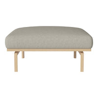 Light gray cushioned ottoman with smooth, minimalistic design and natural wood legs. Perfect for any modern space.