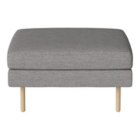 Gray upholstered ottoman with a minimalist design and light wooden legs. Simple, modern, and stylish accent piece.