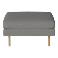 Gray upholstered ottoman with textured fabric and light wooden legs.