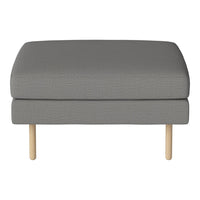 Gray cushioned ottoman with a textured fabric and light wooden legs, perfect for modern decor.