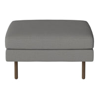 Gray upholstered ottoman with a subtle textured pattern and wooden legs. Perfect for modern decor.