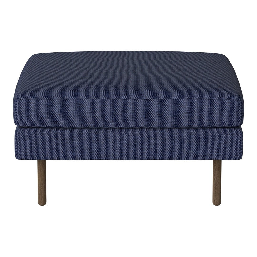 Navy blue upholstered ottoman with a textured pattern and sleek metal legs, perfect for modern decor.