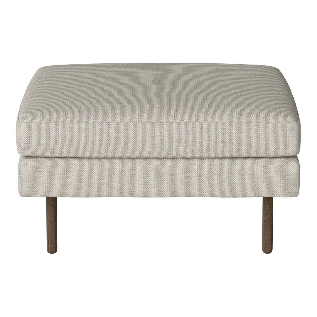 Neutral beige upholstered ottoman with a smooth texture and sleek brown legs. Ideal for versatile decor styles.
