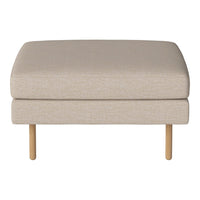 Beige upholstered ottoman with a smooth texture and light wooden legs. Minimalist design for modern decor.