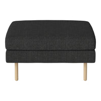 Black textured ottoman with natural wood legs, offering a modern and sleek look for any living space.