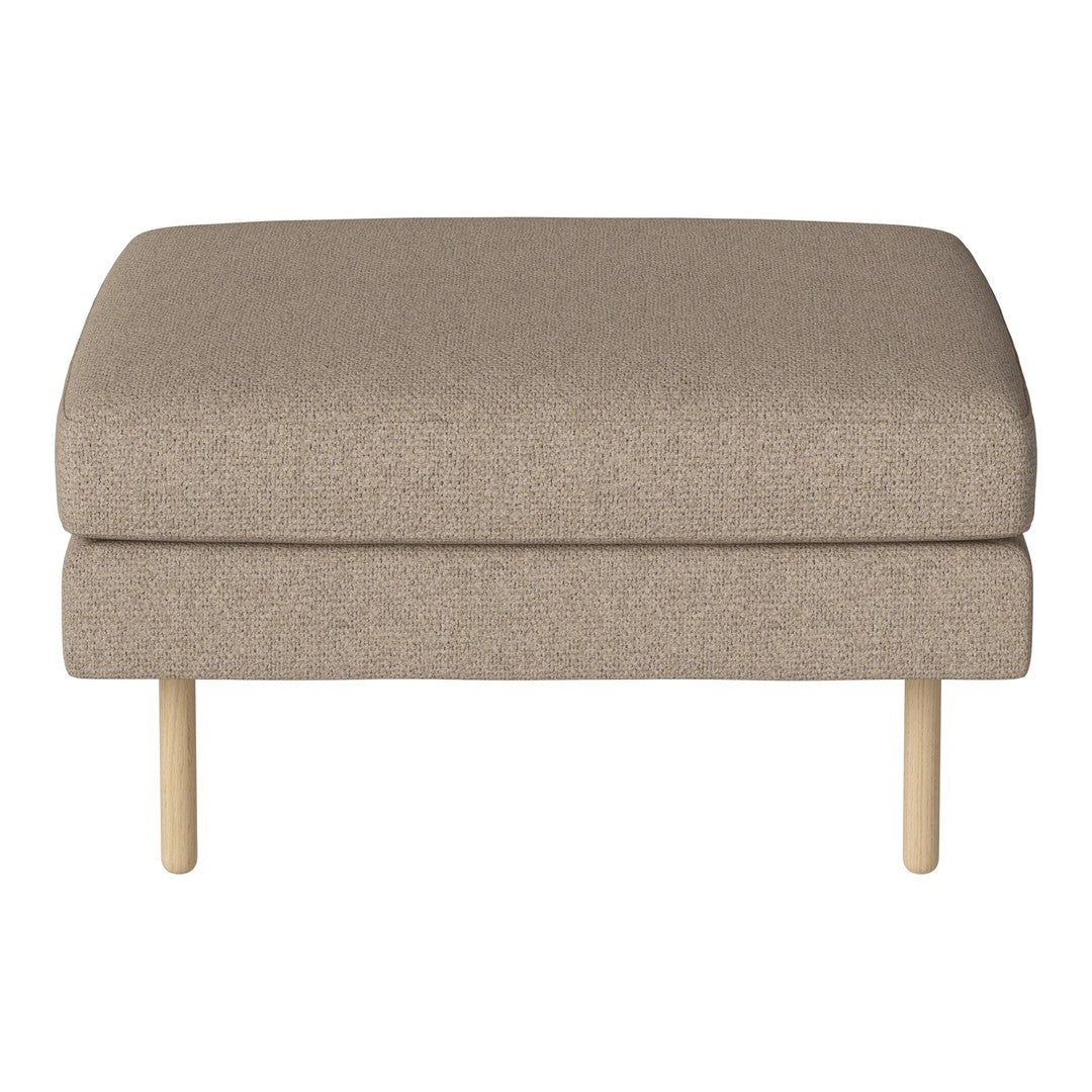 Beige upholstered ottoman with a smooth texture and light wooden legs, perfect for versatile decor.