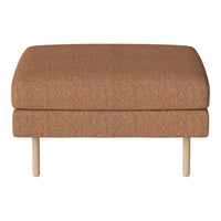 "Modern ottoman in warm terracotta with a textured pattern and light wooden legs, perfect for any contemporary space."