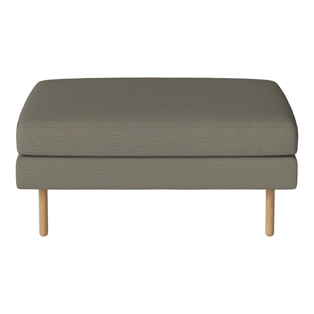 Gray upholstered ottoman with a smooth texture and natural wood legs, perfect for modern living spaces.