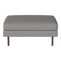 Gray upholstered ottoman with a smooth fabric texture and sleek metal legs. Ideal for modern decor.