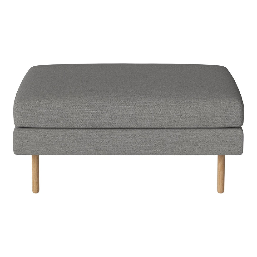 Gray upholstered ottoman with a smooth texture and light wood legs, perfect for modern living spaces.