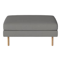 Gray upholstered ottoman with a smooth texture and light wood legs, perfect for modern living spaces.