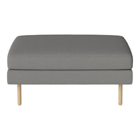 Gray upholstered ottoman with a smooth surface and light wooden legs, offering a modern, minimalist design.