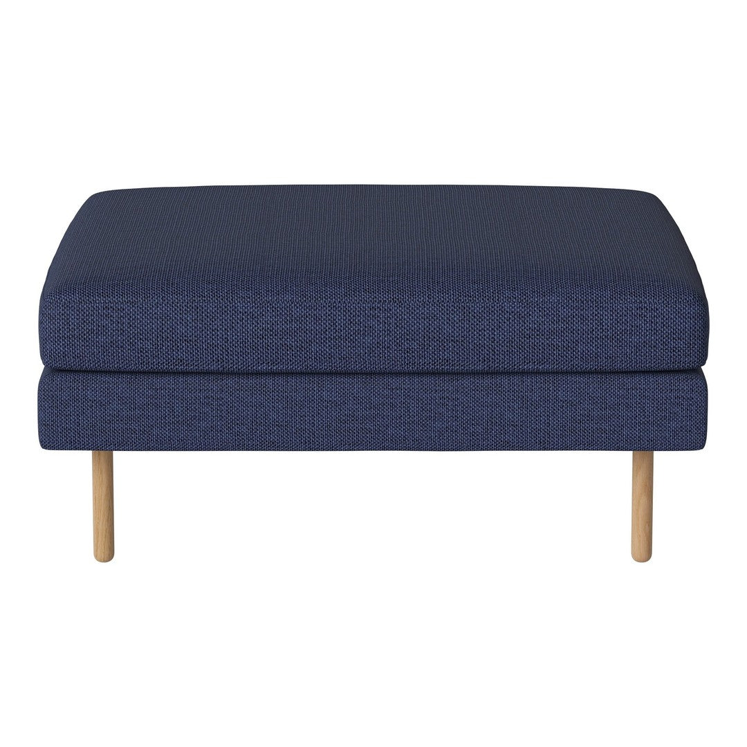 Navy blue upholstered ottoman with a textured pattern and light wooden legs. Ideal for modern living spaces.