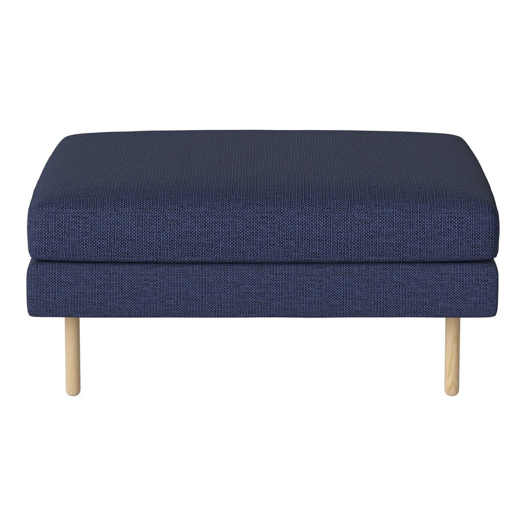 Navy-blue upholstered ottoman with a textured fabric and natural wooden legs. Modern, minimalist design.