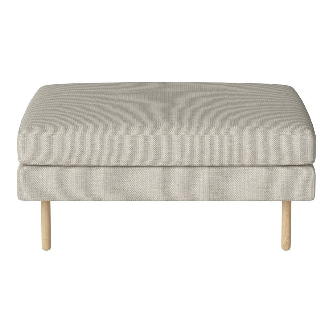Light beige upholstered ottoman with smooth texture and natural wood legs. Minimalist design complements any decor.