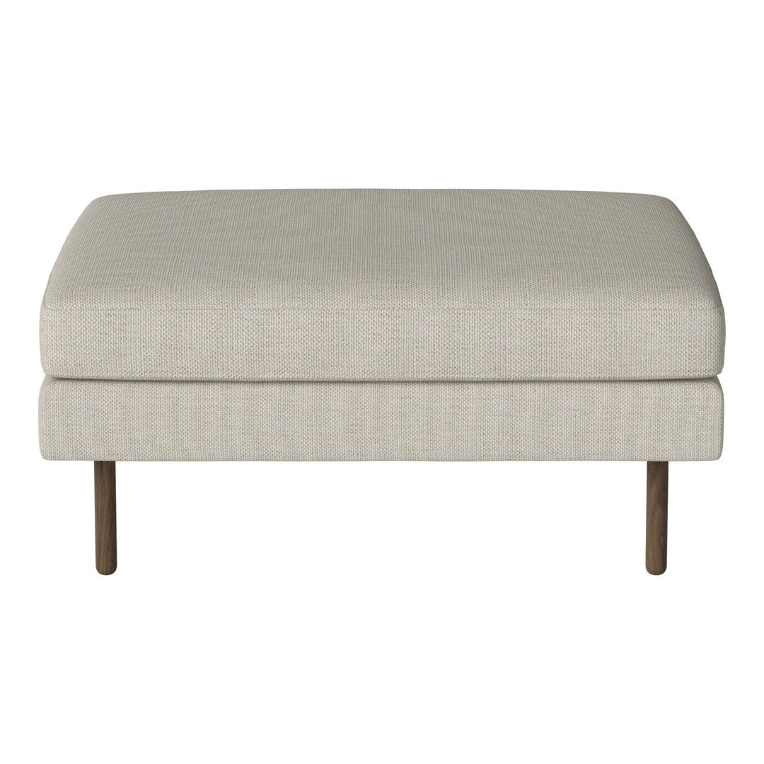 Beige upholstered ottoman with smooth texture and minimalist design, featuring wooden legs for a modern touch.