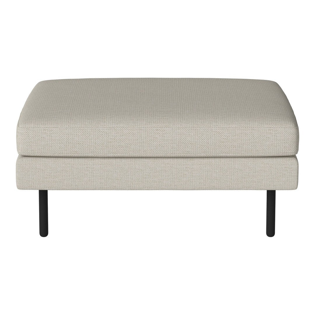 Light beige upholstered ottoman with a smooth texture and sleek black metal legs. Ideal for modern decor.
