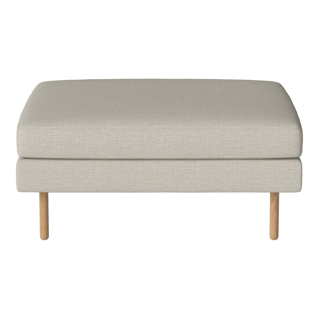 Beige upholstered ottoman with a smooth texture and natural wood legs. Perfect for modern living spaces.
