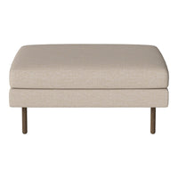 Beige upholstered ottoman with a smooth texture and minimalist design. Features sleek metal legs for a modern touch.
