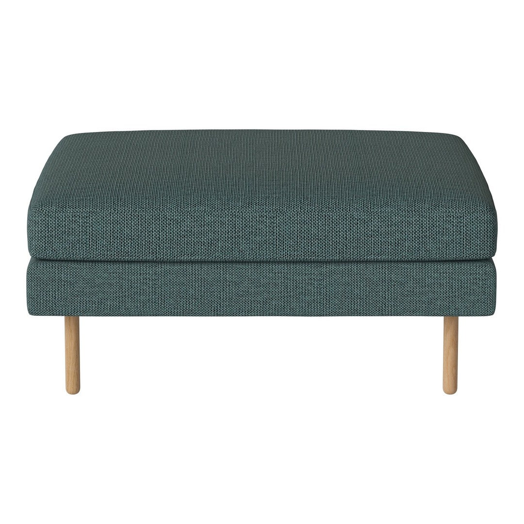Teal upholstered ottoman with textured fabric, featuring natural wood legs for a modern look.