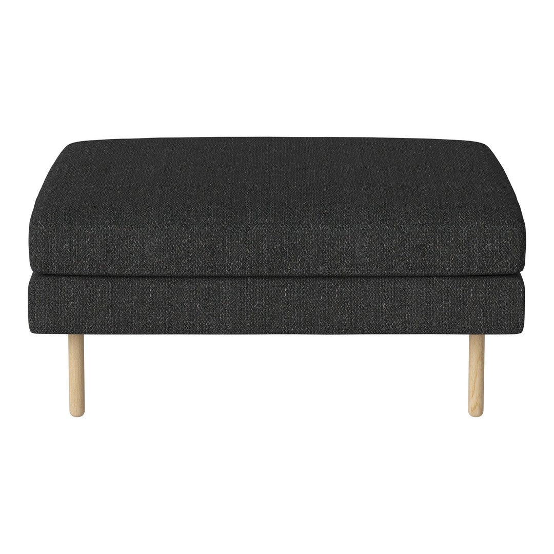 Dark gray upholstered ottoman with a textured fabric and light wood legs, featuring a simple, modern design.