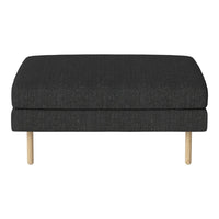Dark gray upholstered ottoman with a textured fabric and light wood legs, featuring a simple, modern design.