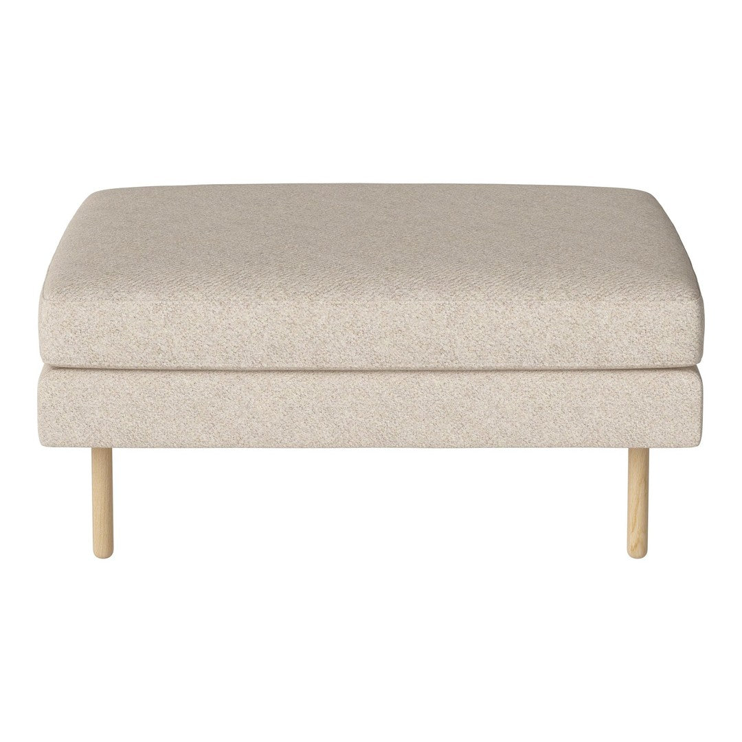 Beige upholstered ottoman with a smooth texture and wooden legs, perfect for modern decor.