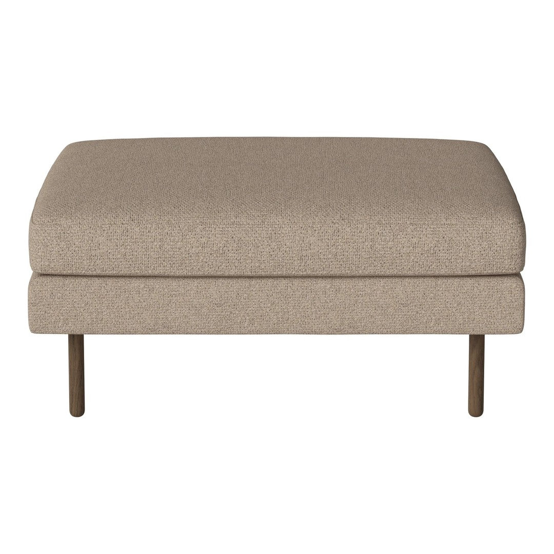 Beige upholstered ottoman with a smooth, solid surface and minimalist design, featuring wooden legs.