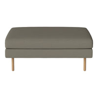 Gray upholstered ottoman with a smooth, solid fabric and natural wood legs, ideal for modern decor.