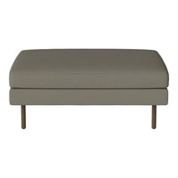 Gray upholstered ottoman with a smooth texture and minimalist design, featuring wooden legs. Perfect for modern interiors.
