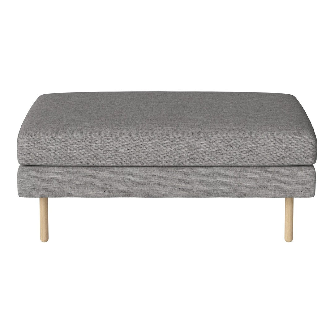 Gray upholstered ottoman with a smooth texture and light wood legs, featuring a minimalist design.