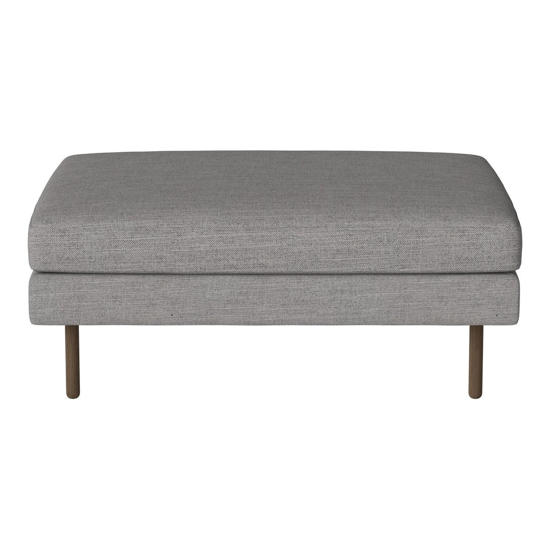 Gray upholstered ottoman with a smooth, minimalist design and metallic legs. Perfect for modern decor.