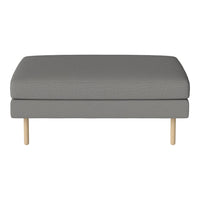 Gray upholstered ottoman with a subtle texture and light wooden legs. Perfect for modern decor.