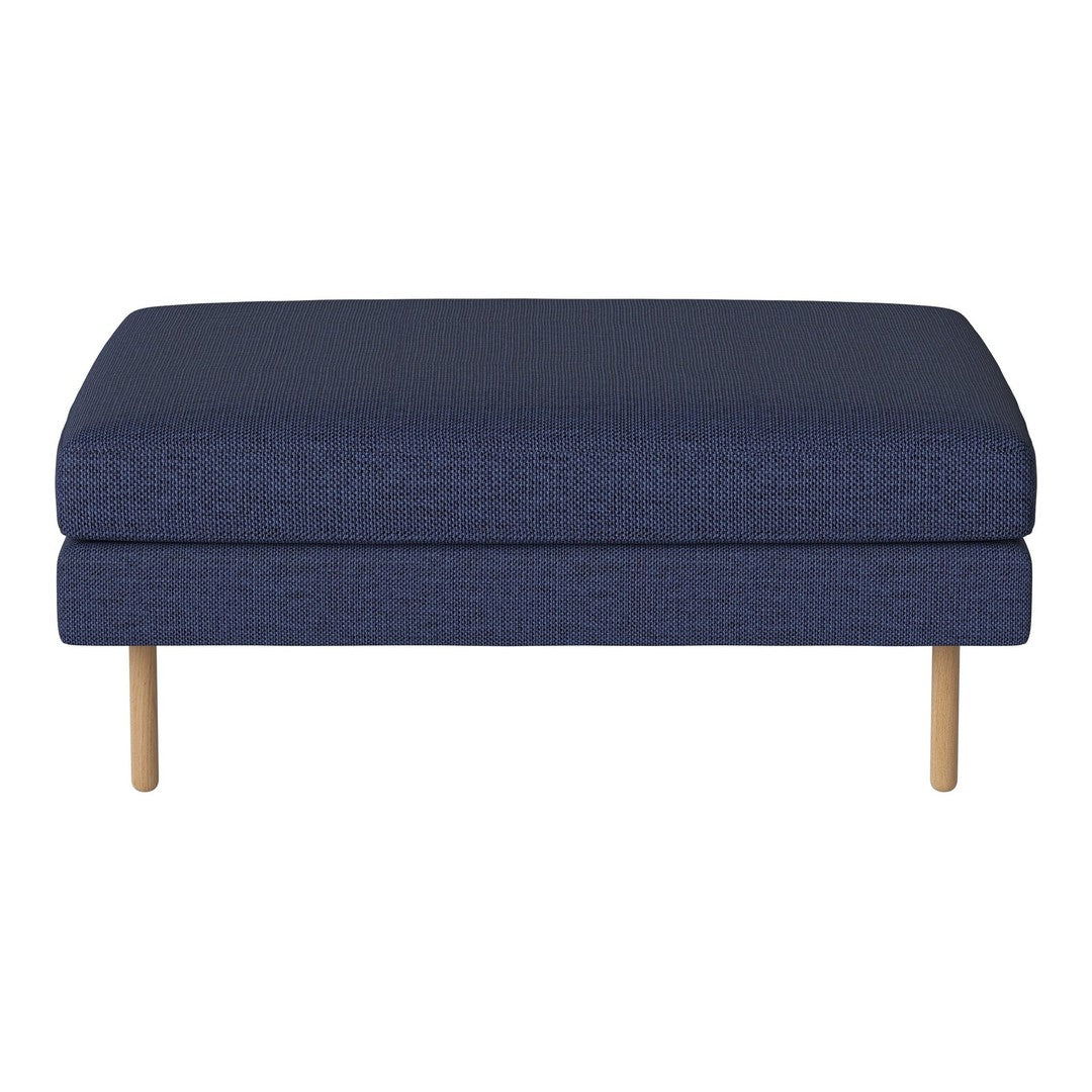 Navy blue upholstered ottoman with a textured pattern and natural wood legs. Ideal for modern living spaces.