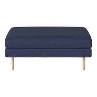 Blue upholstered ottoman with a textured pattern and light wooden legs, perfect for modern living spaces.