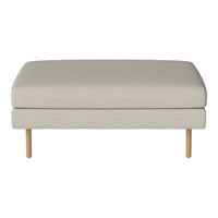 Light beige fabric ottoman with a simple, smooth surface and natural wood legs, perfect for minimalistic decor.