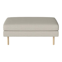 Light gray upholstered ottoman with a smooth texture and natural wood legs. Simple and modern design.