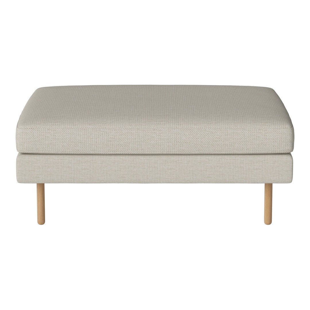 Light beige upholstered ottoman with a smooth texture and minimalist design, featuring wooden legs for a modern touch.