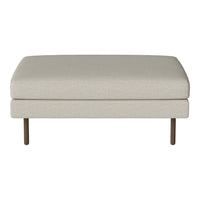 Neutral beige upholstered ottoman with a smooth texture and minimalist design, featuring sleek wooden legs.