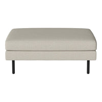 Light beige upholstered ottoman with a smooth texture and black metal legs. Simple and modern design.