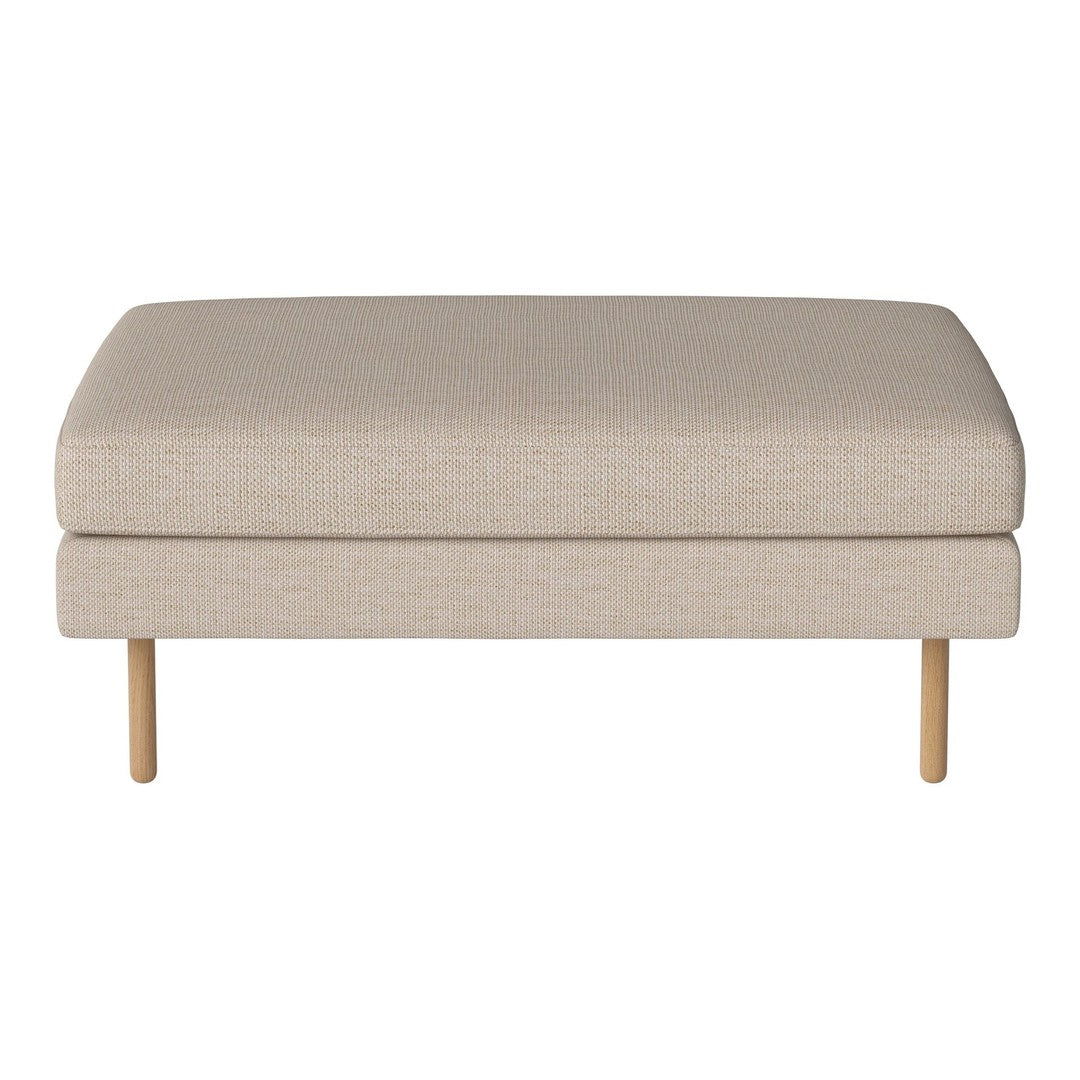 Beige upholstered ottoman with a smooth texture and wooden legs, ideal for modern living spaces.