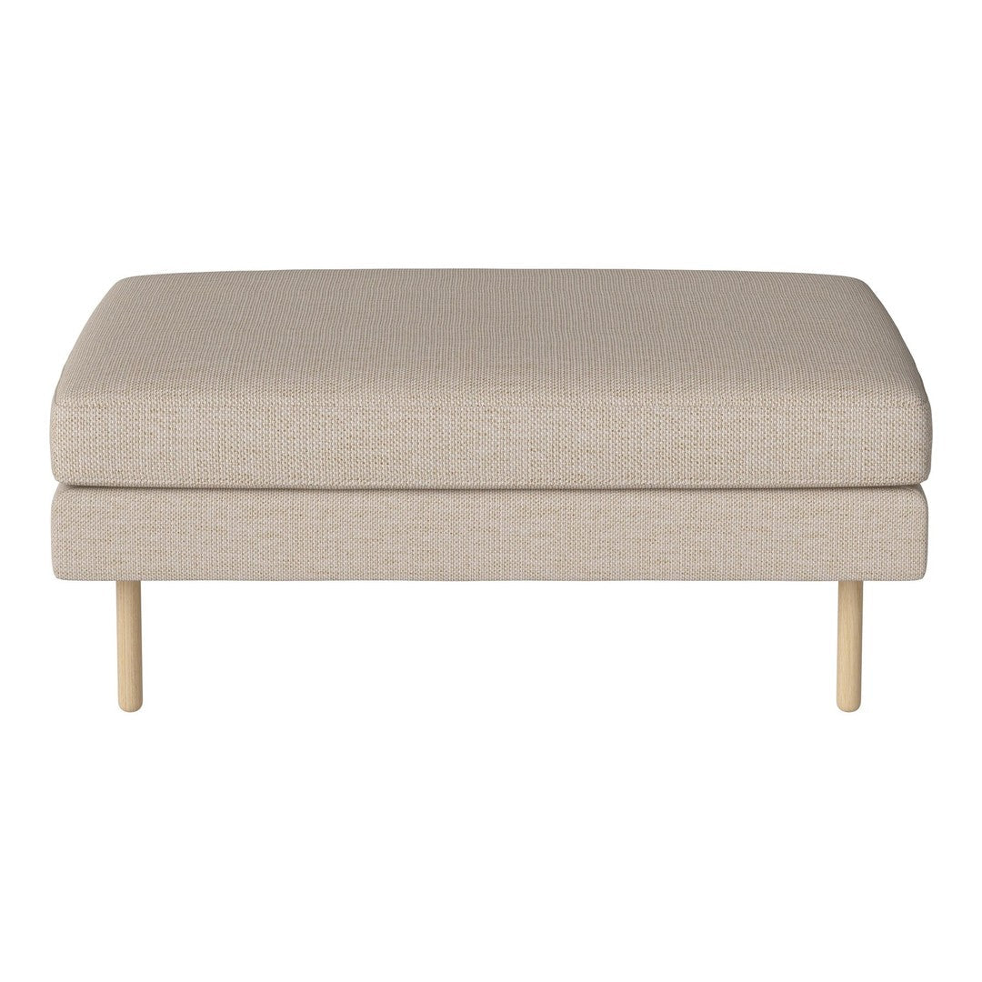 Light beige upholstered ottoman with smooth texture and minimalist design, featuring wooden legs.