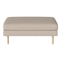 Light beige upholstered ottoman with smooth texture and minimalist design, featuring wooden legs.