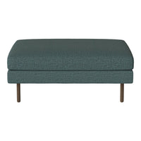 Teal upholstered ottoman with a textured pattern and wooden legs, perfect for modern decor.
