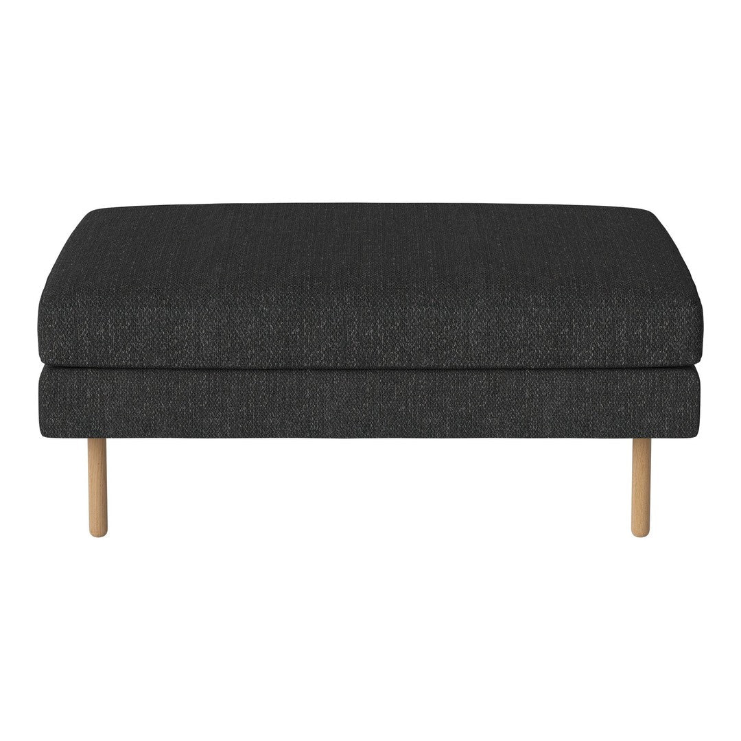 Dark gray upholstered ottoman featuring a simple, textured pattern with natural wood legs.