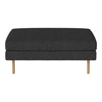Dark gray fabric ottoman with a smooth texture and light wood legs, ideal for modern decor.