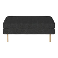 Gray upholstered ottoman with a smooth texture and light wooden legs, providing a modern and minimalist look.