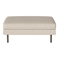 Beige upholstered ottoman with a smooth, solid surface and metal legs. Perfect for modern interiors.