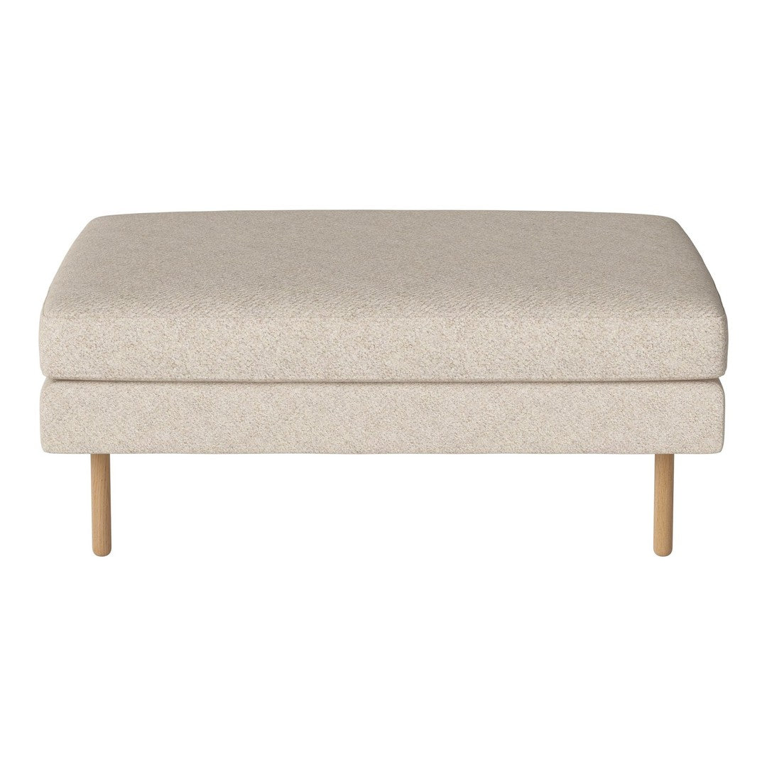 Light beige ottoman with a textured fabric and wooden legs, perfect for minimalist decor.