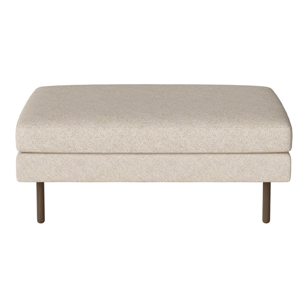 Neutral beige ottoman with a smooth, textured fabric and minimalist design, featuring sleek metal legs.
